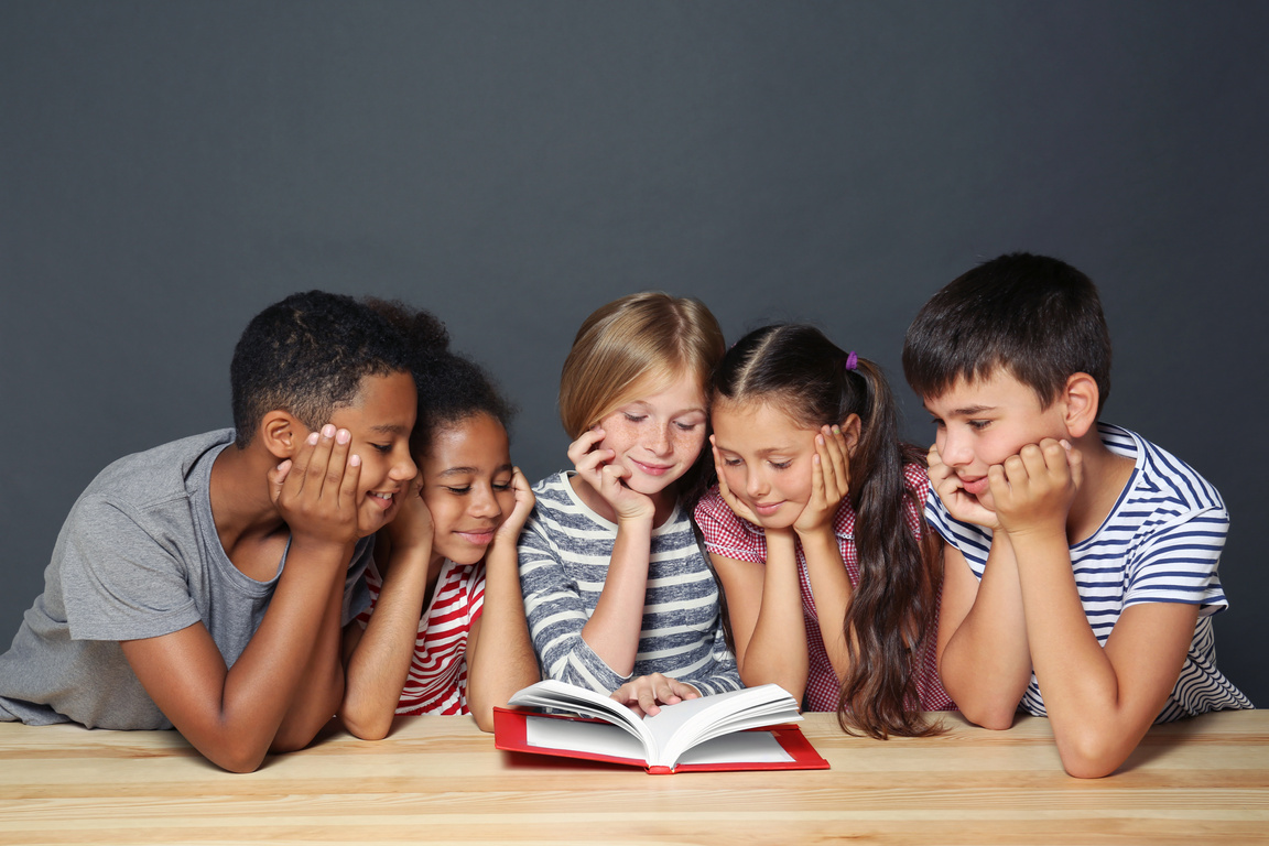 Group of Kids Reading a Book